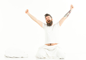 Hipster with beard stretching arms, energetic and successful
