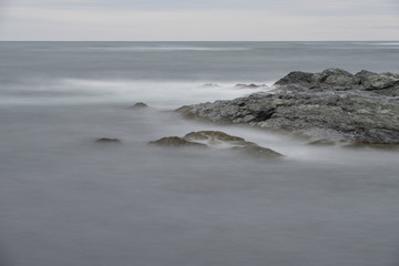 Ocean Waves Over Rocks at Cliff Walk in Rhode Island