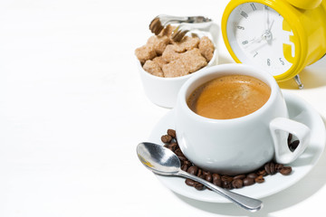 morning cup of espresso and alarm clock on white background