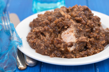 rice with rabbit on dish on blue wooden background