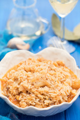 rice wtih cod fish and tomato on beautiful white bowl