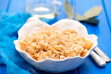 rice wtih cod fish and tomato on beautiful white bowl