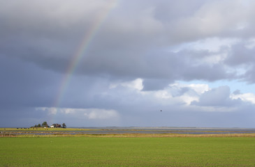 Thunderstorm with rainbow on the island "Amrum", Northern Germany.