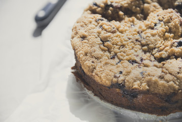 Tasty berries coffee cake on white wooden table. Horizontal. Copy space. 
