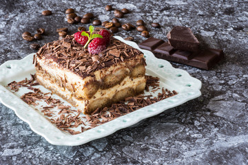 Homemade Tiramisu Cake Dessert with Grated Chocolate, Raspberry and Mint
