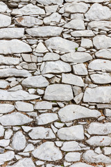 Stone wall made with white marble blocks