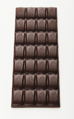 Bar of dark chocolate isolated on white