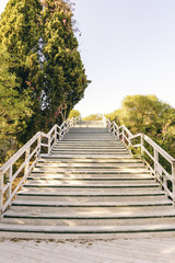 Sun shines in a long staircase