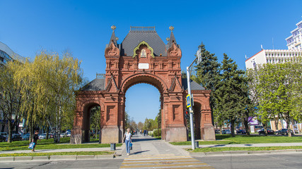 The Arc de Triomphe is an architectural monument in Krasnodar, located at the intersection of two streets - Babushkina and Krasnaya. Krasnodar, Russia - April 10, 2018.