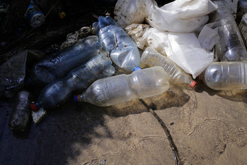 Heavy polluted water stream with domestic garbage