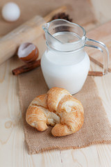Croissant on wooden table wood and fabric select focus shallow depth of field