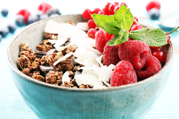 granola healthy breakfast with natural yogurt, muesli and berries