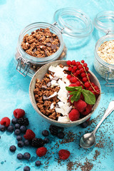 granola healthy breakfast with natural yogurt, muesli and berries