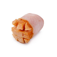 Small sausages wrapped in a blanket of smoked streaky bacon isolated on white background