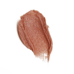 Cosmetics products smeared on white