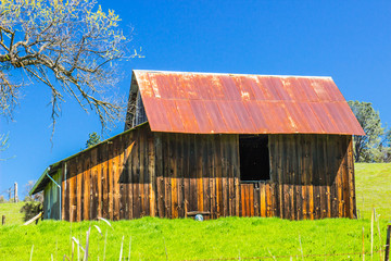 Old Wooden Barn With Rusty Tin Roof