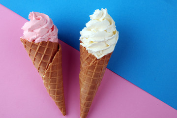 Vanilla frozen yogurt or soft ice cream in waffle cone.