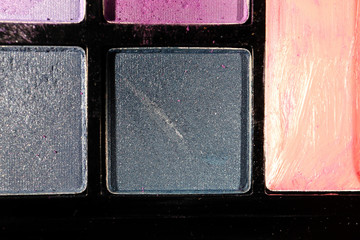 Eye shadow on a black background. Close up