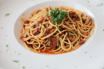 Spaghetti bolognese with beef tometo sauce on wood table , italian food