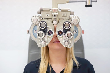 Women ophthalmologist examining patient. Male patient to check vision in ophthalmological clinic