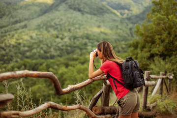 Fototapeta na wymiar Young woman hiking and exploring the mountain