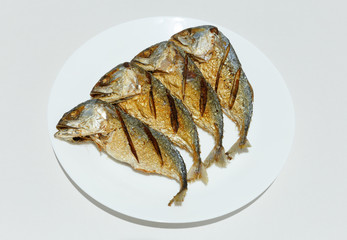 Fried Mackerel on white plate
