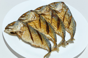 Fried Mackerel on white plate