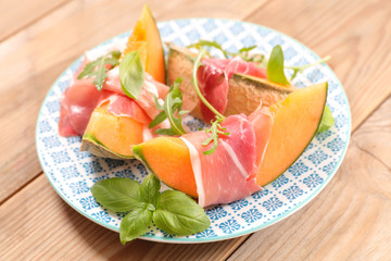 melon slice and prosciutto