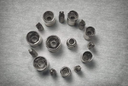 End head tool socket wrenches spanner for unscrewing nuts standing in a circle on a light background