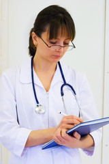 Doctor writing medical prescription