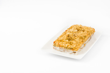 White fish casserole with cheese isolated on white background. Copyspace
