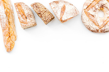Bread shop. Baker's shop. Assorted bread on white background top view space for text