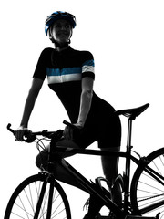 Fototapeta premium one caucasian cyclist woman cycling riding bicycle in silhouette isolated on white background
