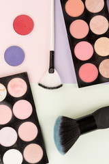 make-up brushes on colored backgrounds