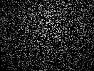 3d rendering of white spheres on a dark background