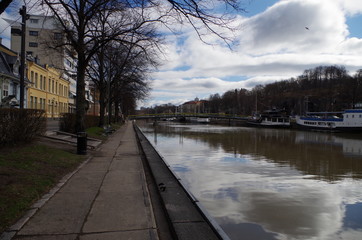 Calm riverside scene in Turku, Finland, at the beginning of spring