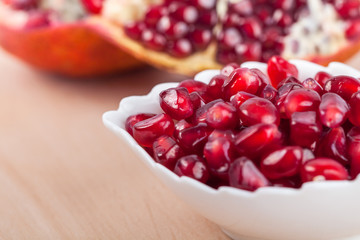 pomegranate seeds on the little plate, food