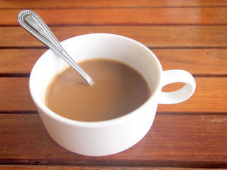 Cup of coffee on wooden table