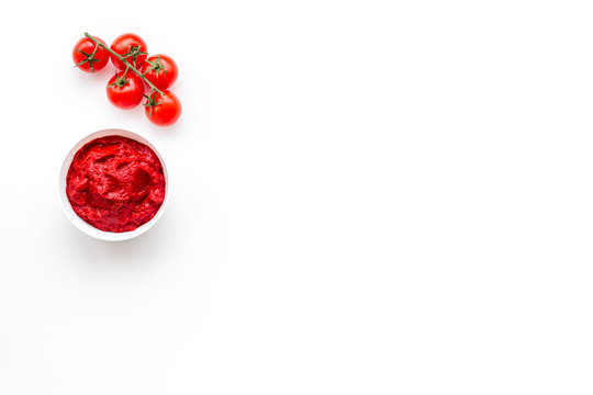 Tomato Sauce In Bowl Near Cherry Tomatoes On White Background Top View Copy Space