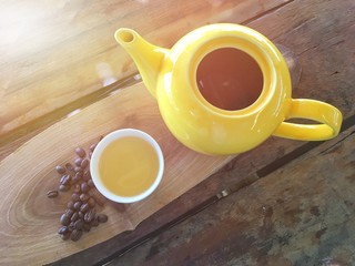Tea made from sun dried peel coffee beans tea in a white cup.