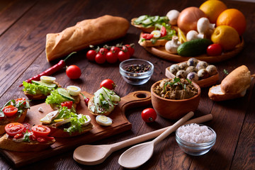 Breakfast still life with sandwiches, quail eggs, spicies and fresh fruits and vegetables, selective focus