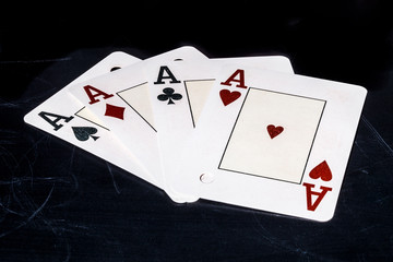 four aces shape on school blackboard concept, photo with space for text