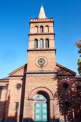 Fototapeta na wymiar Gothic parish church with belfry in Gniezno.