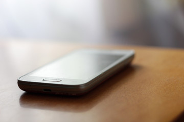 Smartphone on a table, usb interface, blurry background