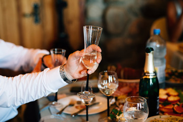 a glass in the man's hand