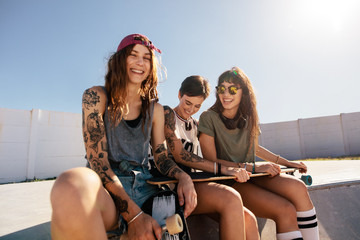 Beautiful woman at skate park with friends © Jacob Lund