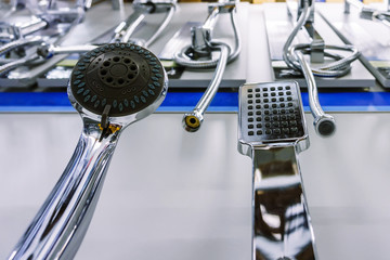 Obraz premium Brilliant shower heads are on display in the shop window