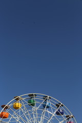 A ferris wheel on top of a hill in Barcelona.