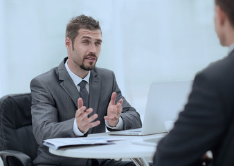 closeup.Manager and client discussing the terms of the contract in the office.