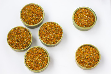 Six  boxes with millet grains. White background. Top view.